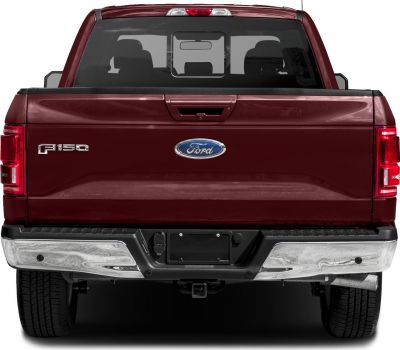 Rear view of pickup tailgate, taillights, and chrome bumper
