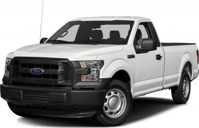 Front view of white regular cab pickup with black grille and steel wheels