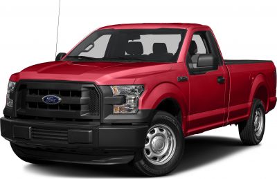 Red pickup truck front side with distinctive grille and headlights