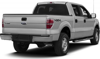 Rear and side view of a 4x4 extended cab pickup with dual exhaust