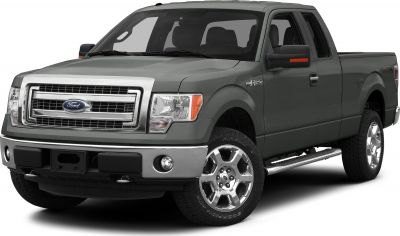 Front side view of a SuperCab pickup with chrome grille and alloy wheels