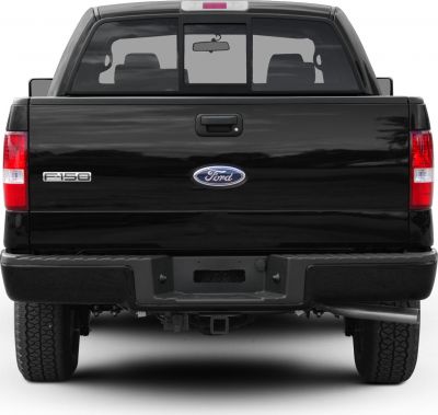 Rear pickup tailgate with red tail lights and rear window