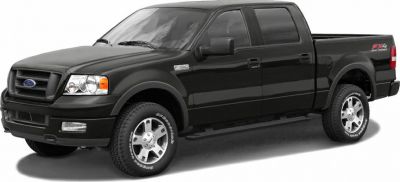 Black pickup truck with crew cab and off-road tires.