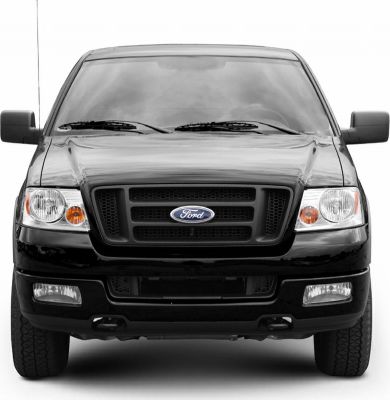 Front view showing black grille, dual headlights, and fog lamps