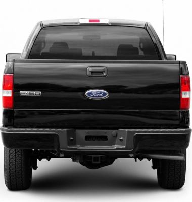 Rear view of a black pickup truck with tailgate and towing hitch