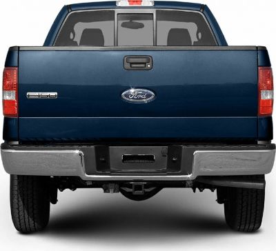 Rear view of pickup tailgate and bumper with brake lights