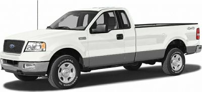 Front and side view of a white pickup with extended bed and 4x4 badge
