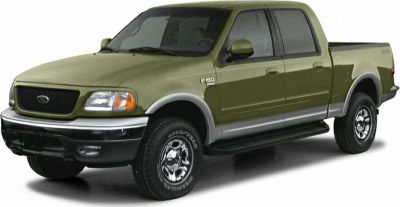 Front-side view of 1999 four-door pickup truck with robust body and rugged tires