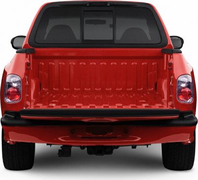 Red pickup truck bed, tailgate, rear bumper with taillights