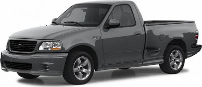 Single cab pickup truck with alloy wheels and extended bed