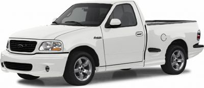 Side view of white single cab pickup truck with alloy wheels