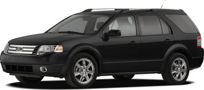 Black SUV with chrome wheels and roof rails