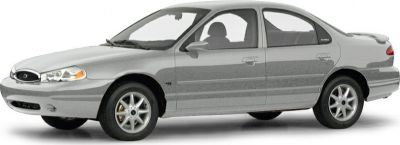 Side profile of a mid-1990s four-door sedan with alloy wheels and smooth body lines