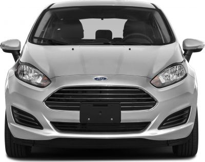 Silver car front view with distinct grille and headlight design