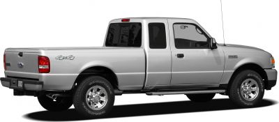 Silver extended cab pickup truck with 4x4 and chrome wheels