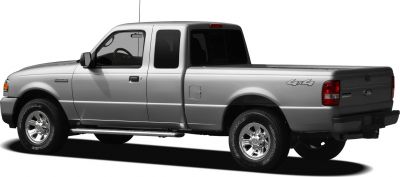 Side profile of extended cab pickup with 4x4 badge and rugged tires
