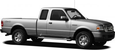 Silver extended cab pickup with 4x4 and chrome wheels