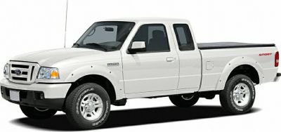White pickup truck with double cab and covered bed.