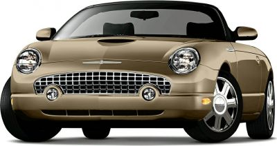Front view with chrome grille, round headlights, and hood scoop