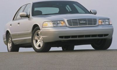 Front view of a full-size sedan with grille and alloy wheels