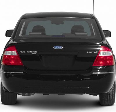 Rear view of a sedan with distinctive taillights and trunk.