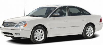 White 4-door sedan with chrome grille and alloy wheels