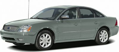 Front side view of sedan with chrome grille and alloy wheels