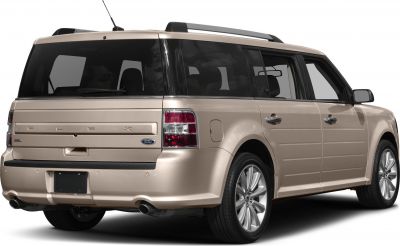 Rear side view of a boxy SUV with dual exhaust and tinted windows