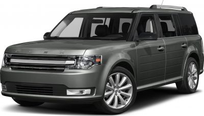 Front side view of a wide SUV with distinct grille and alloy wheels