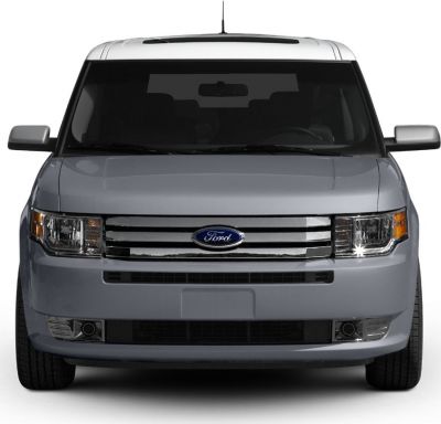 Distinctive horizontal grille with rectangular headlights and wide body front view