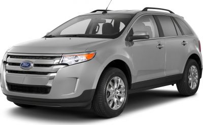 Front and side view of midsize silver SUV with chrome grille and alloy wheels