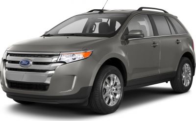 Front-side view of an SUV with chrome grille and roof rails