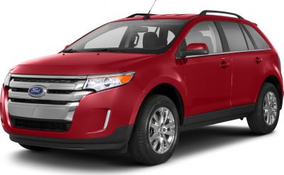 Front-side view of red mid-size SUV with chrome grille and alloy wheels
