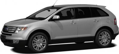 Front-side view of silver SUV with alloy wheels and grille