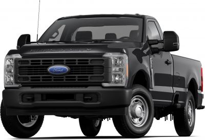 Heavy-duty pickup truck front grille with long cargo bed and large side mirrors.