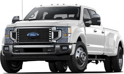 Heavy-duty truck front view with robust grille and dual rear wheels