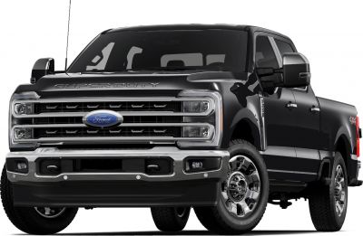 Front view of pickup with chrome grille and large side mirrors