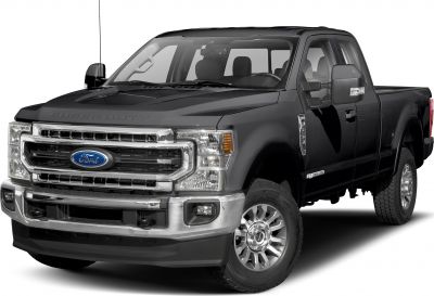 Front side view of a heavy-duty pickup with chrome grille and extended cab.