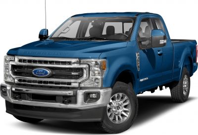 Front view of blue pickup with chrome grille and rugged wheels