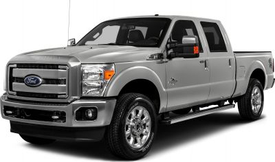 Front view of a crew cab short box pickup with chrome grille and rugged design