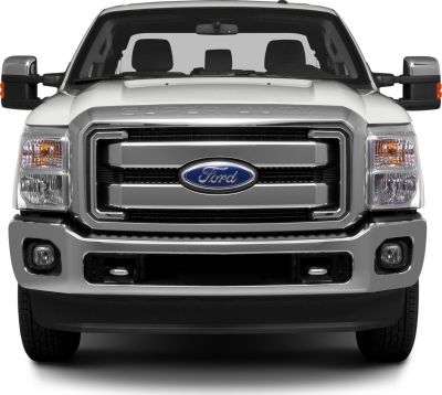 Front view of a heavy-duty pickup truck with chrome grille and large headlights