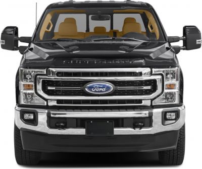Front view of pickup truck with chrome grille and large tow mirrors