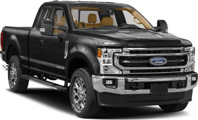 Front perspective of heavy-duty pickup with chrome grille and long cargo bed