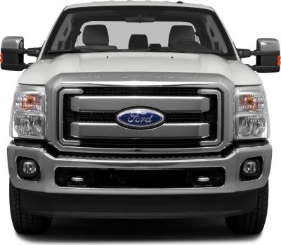 Front view of heavy-duty truck grille, headlights, and bumper