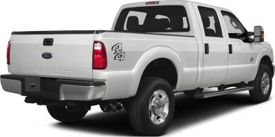 Rear side view of a crew cab short box pickup with 4x4 and dual exhaust