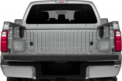 Open short box truck bed with visible tailgate and rear lights
