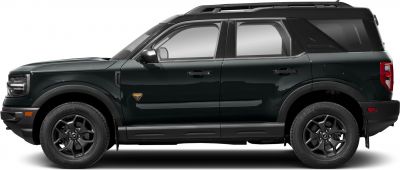 Side profile of rugged SUV with black wheels and distinctive badge