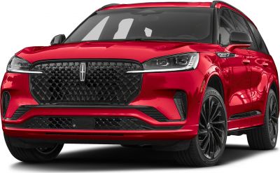 Bold front grille and LED headlights of a red luxury SUV