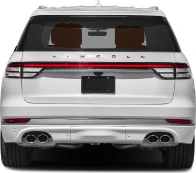 Rear view with quad exhaust tips and full-width LED tail light bar
