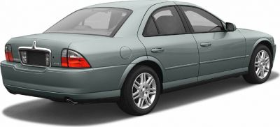 Sedan rear side view with alloy wheels and chrome trim.